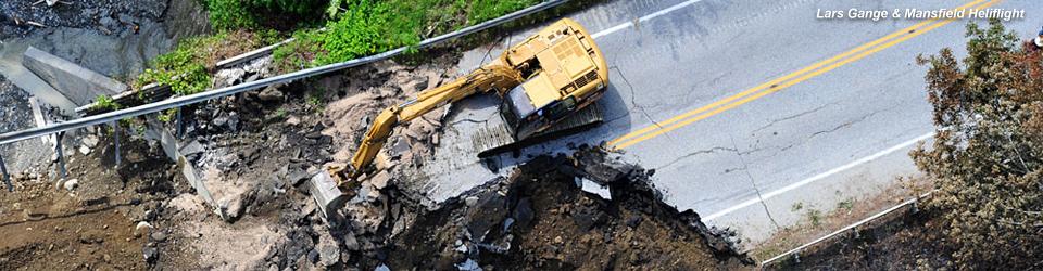 Arial view of an excavator working on a washed out road